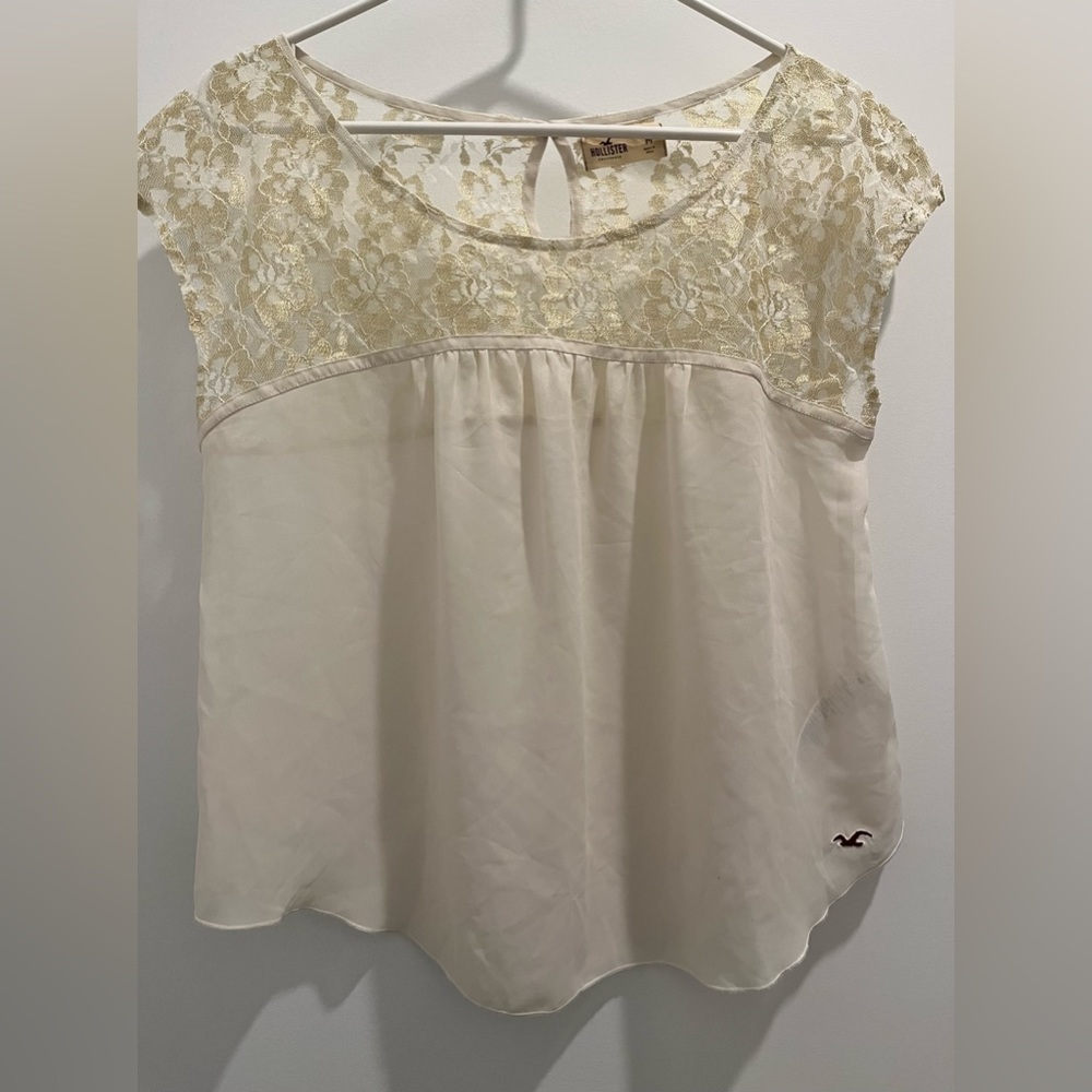 Hollister  cream color top gold shimmer lace on the top keyhole back Top size M